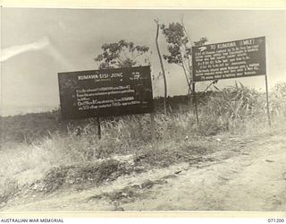 FINSCHHAFEN AREA, NEW GUINEA, 1944-03-17. TWO OF THE MANY BATTLE SIGNS IN THE FINSCHHAFEN AREA, THESE SIGNS RECORD ACTIVITIES OF THE 2/15TH, 2/17TH, 2/23RD AND 2/48TH INFANTRY BATTALIONS AT THE ..