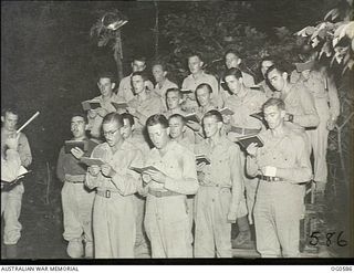 KIRIWINA, TROBRIAND ISLANDS, PAPUA. C. 1944-02. GROUP PORTRAIT OF THE CHOIR AT A CHURCH SERVICE FOR THE RAAF AT KIRIWINA HELD IN AN OPEN AIR CHURCH KNOWN AS THE CORAL CATHEDRAL