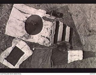 NADZAB AIRSTRIP, NEW GUINEA. 1943-09-18. JAPANESE REGIMENTAL FLAGS WHICH WERE BROUGHT BACK TO THE STRIP FROM LAE