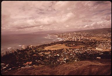 HONOLULU WATERFRONT SEEN FROM THE TOP OF DIAMOND HEAD, THE EXTINCT VOLCANO WHICH IS THE ISLAND'S BEST-KNOWN LANDMARK