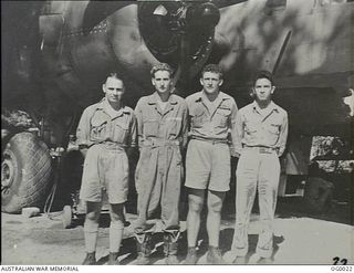 PORT MORESBY, PAPUA. C. 1943. RAAF AND USA AIRMEN WHO FLY TOGETHER AS THE CREW OF AN AMERICAN B-25 MITCHELL BOMBER AIRCRAFT. RAAF MEMBER IDENTIFIED BY WEARING OF WINGS INSIGNIA OVER LEFT BREAST