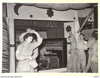 LAE AREA, NEW GUINEA. 1945-08-11. A DANCE AND STAGE PRESENTATION WAS HELD AT THE LAE BASE SUB-AREA SERGEANTS' MESS. SHOWN, DANCE WHICH FOLLOWED THE STAGE PRESENTATION