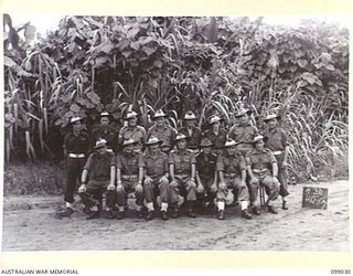 Group portrait of the personnel of HQ Company, 30 Advanced Supply Depot. Left to right, back row: QX62774 Staff Sergeant (SSgt) K R Crust of Chelmer, Qld; NX193909 Private (Pte) L G Brown of ..