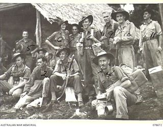 SAMPUN, NEW BRITAIN. 1945-01-27. TROOPS OF THE 14/32ND INFANTRY BATTALION WAITING ON THE BEACH FOR THE ORDER TO EMBARK ABOARD THE LCM'S (LANDING CRAFT MECHANISED) FOR THE NIGHT LANDING AT KEIP ..