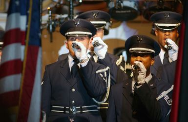 US Air Force (USAF) AIRMAN First Class (A1C) Chad Goff assigned to the 36th Security Forces Squadron (SFS), Anderson Air Force Base (AFB), Guam (GU), along with other members of the USAF's premiere entertainment group "Tops In Blue" perform the American National Anthem during their performance at Ramstein Air Base (AB), Germany (DEU)