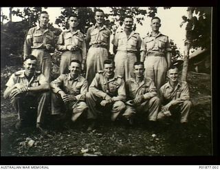 Laloki River Area, Port Moresby, New Guinea. 1943-04. Group portrait of pilots of No. 33 Squadron RAAF at camp. Left to right: Back row: Sergeant (Sgt) Colin Wright, ?, ?, Pilot Officer (PO) Keith ..