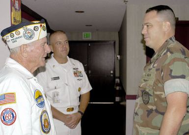 U.S. Navy"Woody"Derby, a Pearl Harbor survivor talks to Sailors at the Pearl Harbor, Hawaii, Sharkey Theater on Dec. 4, 2006. Derby was a storekeeper 2nd class on battleship USS NEVADA (BB 36). (U.S. Navy PHOTO by Mass Communication SPECIALIST 2nd Class Lindsay J. Switzer) (Released)