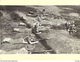 SIAR, NEW GUINEA. 1944-06-25. NX137778 LIEUTENANT T.W.R. TEARNE (8) INSTRUCTING TROOPS OF A COMPANY 57/60TH INFANTRY BATTALION IN THE USE AND SAFE HANDLING OF THE BREN GUN. IDENTIFIED PERSONNEL ..