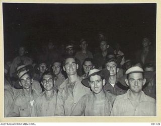 BOSELY FIELD, TOROKINA, BOUGAINVILLE. 1945-04-21. A SECTION OF THE CROWD ATTENDING THE SECOND OF A SERIES OF INTERNATIONAL BOXING TOURNAMENTS ORGANISED BY DEPUTY ASSISTANT DIRECTOR AMENITIES, 2 ..