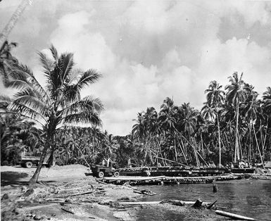 Scene at Vella Lavella, Solomon Islands, with World War 2 soldiers of 3 NZ Div Eng building a bridge