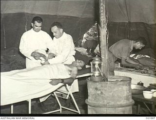 AITAPE, NORTH EAST NEW GUINEA. C. 1944-04. INTERIOR OF A SELF CONTAINED RAAF HOSPITAL UNIT IN AN OPERATING THEATRE. IT WAS THE FIRST TIME A RAAF MEDICAL UNIT HAD LANDED WITH ASSAULT TROOPS. LEFT TO ..