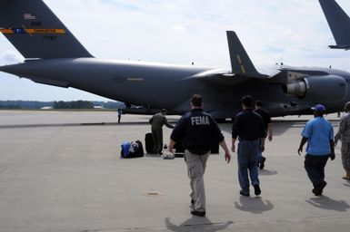 Flooding ^ Tsunami - Atlanta, Ga. , October 2, 2009 -- Approximately 30 FEMA Logistics (LOG) staff and equipment will depart Dobbins Air Force Base via C-17 cargo planes for Hickam Air Force Base in Hawaii to set up logistical assistance in response to the recent Samoan devastating tsunami. FEMA personnel must be ready for short notice rapid deployment to national disasters. George Armstrong/FEMA