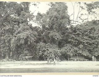 JACQUINOT BAY, NEW BRITAIN. 1944-11-12. AN AUSTRALIAN ARMY CAMP SET AMONG THE LUSLH TROPICAL VEGETATION AT THE MOUTH OF AN UNNAMED RIVER IN RONDAHL HARBOUR NEAR MARAU PLANTATION