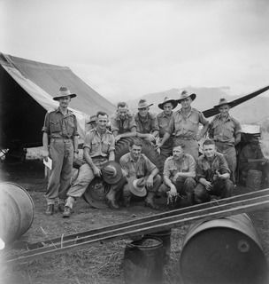 MARKHAM VALLEY, NEW GUINEA. 1944-08-28. PERSONNEL OF THE MOTOR TRANSPORT SECTION OF THE 4TH FIELD REGIMENT. IDENTIFIED PERSONNEL ARE: VX142066 LIEUTENANT R.H. SULLIVAN (1); VX64694 GUNNER V.G. ..