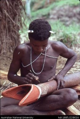 Decoration of a drum in preparation for use in a ceremony