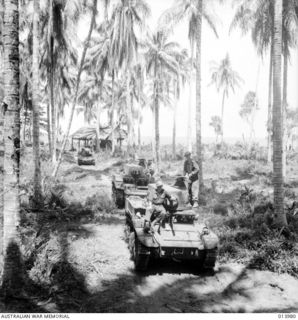 Following overhaul after three days of continuous action, Australian M3 Stuart light manned tanks move forward for further action, eventually leading to the final assault on Buna