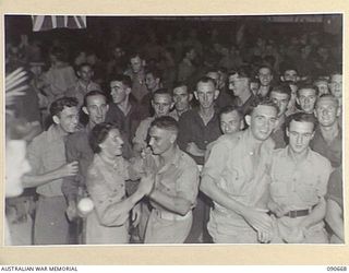 TOROKINA, BOUGAINVILLE. 1945-04-16. A SECTION OF THE CROWD WHO ATTENDED THE DANCE HELD IN THE OTHER RANKS CLUB, HALSEY FIELD