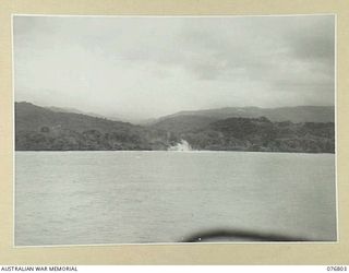 WIDE BAY, NEW BRITAIN. 1944-11-04. SHELLS FROM RAN VESSELS EXPLODING ON JAPANESE POSITIONS IN THE AREA