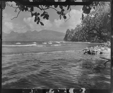 Coastal scene, Tahiti, showing ocean, hills and trees