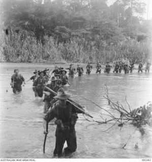 GAZELLE PENINSULA, NEW BRITAIN, 1945-05-15. TROOPS OF A COMPANY, 37/52 INFANTRY BATTALION, CROSSING A RIVER DURING THE LAST DAY OF THEIR TREK FROM RILE TO MAVELU, OPEN BAY. ATER CROSSING THE MAVELO ..