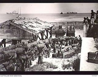 NAURU ISLAND. 1945-09-16. JAPANESE POWS MOVING TO THE WHARF FOR EVACUATION TO BOUGAINVILLE SOON AFTER TROOPS OF THE 31/51ST INFANTRY BATTALION TOOK OVER THE ISLAND