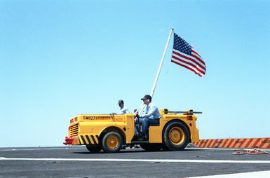 A left side view of a tow tractor used to maneuver helicopters on the deck of the amphibious assault ship USS GUAM (LPH 9)