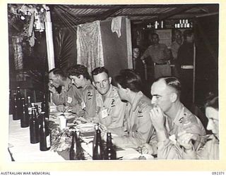 LAE, NEW GUINEA, 1945-05-23. AUSTRALIAN WOMEN'S ARMY SERVICE PERSONNEL AT THE OFFICIAL TABLE, NUMBER 3 SERGEANTS' MESS, HEADQUARTERS FIRST ARMY. AUSTRALIAN WOMEN'S ARMY SERVICE ARE IN LAE TO ..