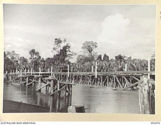 BOUGAINVILLE. 1945-05-30. A JEEP CROSSING THE BOX GIRDER BRIDGE OVER THE TAVERA RIVER CONSTRUCTED BY 11 FIELD COMPANY ROYAL AUSTRALIAN ENGINEERS. ALL THE BRIDGES ON THE TOROKINA-TOKO ROAD HAVE BEEN ..