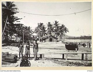 MILNE BAY, NEW GUINEA. 1944-05-16. THE 1ST WATER TRANSPORT GROUP, AUSTRALIAN ELECTRICAL AND MECHANICAL ENGINEERS, LOOKING ACROSS THE CHINA STRAITS. THE BUILDINGS AT THE BACKGROUND COMPRISE ..