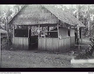MILNE BAY, PAPUA. 1944-05. EXTERIOR OF THE HOSPITAL X-RAY ROOM. (NAVAL HISTORICAL COLLECTION)