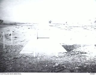 WEWAK, NEW GUINEA, 1946-02-10. THE CONCRETE CAIRN ERECTED AS A MONUMENT AT CAPE WOM AIRSTRIP ON THE SPOT WHERE LIEUTENANT GENERAL HATAZO ADACHI, COMMANDER JAPANESE 18TH ARMY SURRENDERED TO MAJOR ..