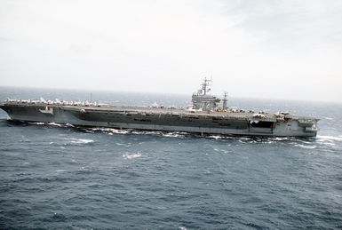 A port beam view of the nuclear-powered aircraft carrier USS Abraham Lincoln (CVN-72) underway near Hawaii