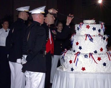 US Marine Corps (USMC) Lieutenant General (LGEN) Wallace Gregson cuts a piece of birthday cake for special guest US Navy (USN) Admiral (ADM) Thomas B. Fargo, not seen, at the USMC Officer Ball, celebrating the 228th anniversary of the founding of the Marine Corps
