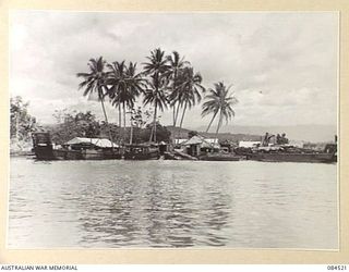 LABU, NEW GUINEA. 1944-12-18. 55 PORT CRAFT COMPANY SHORE INSTALLATIONS FROM A LAUNCH ON THE MARKHAM RIVER