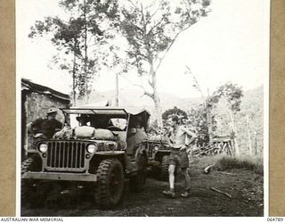 AN AUSTRALIAN ARMY JEEP ABOUT TO LEAVE OWERS' CORNER LOADED WITH THE CAMERAS AND EQUIPMENT OF CHAUVEL ENTERPRISES LTD., WHO ARE PHOTOGRAPHING THE FINAL SEQUENCES OF THE "RATS OF TOBRUK" IN THE AREA