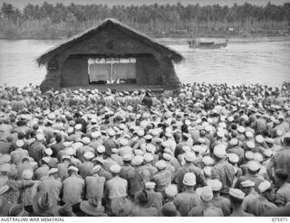 ALEXISHAFEN, NEW GUINEA. 1944-08-31. A SECTION OF THE LARGE CROWD OF ALLIED SERVICE PERSONNEL WAITING FOR THE COMMENCEMENT OF THE CONCERT STAGED BY THE BOB HOPE CONCERT PARTY