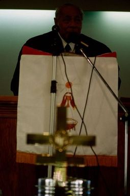 King Taufa'ahau Tupou IV speaking from the pulpit at the dedication of Vaine Mo'onia (The True Vine) church