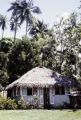 French Polynesia, thatched-roofed cottage on Tahiti Island