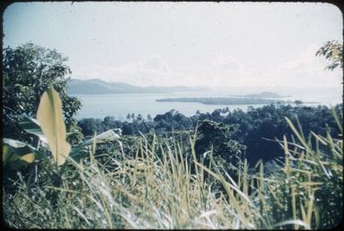 Looking at Sanaroa Island and north along the Fergusson Island coastline : Fergusson Island, D'Entrecasteaux Islands, Papua New Guinea, 1956 / Terence and Margaret Spencer