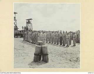 TOROKINA, BOUGAINVILLE ISLAND. 1944-12-15. AUSTRALIAN AND AMERICAN SERVICE OFFICERS DRAWN UP ON THE BEACH AT NO 4 WHARF TO BID FAREWELL TO MAJOR GENERAL O.W. GRISWOLD, COMMANDING GENERAL, 14TH ..