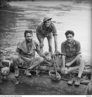 KALIKODOBU, NEW GUINEA. 1942-10. THREE MEMBERS OF THE PARTY OF THE 2/14TH INFANTRY BATTALION WHICH WAS CUT OFF FROM THE MAIN BODY OF TROOPS NEAR MYOLA DURING THE WITHDRAWAL ACROSS THE OWEN STANLEY ..