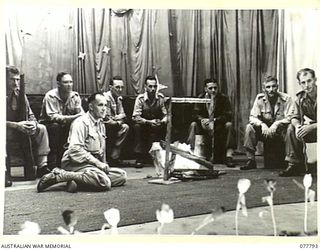 LAE BASE AREA, NEW GUINEA. 1944-12-27. A SCENE FROM "SONGS AROUND THE CAMP FIRE" DURING THE CHRISTMAS CONCERT STAGED IN THE AUDITORIUM OF THE 22ND WORKS COMPANY