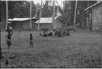 Mortuary ceremony: women gather with exchange items, including baskets of banana leaf bundles