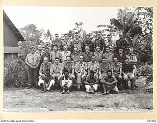 LAE AREA, NEW GUINEA. 1945-08-31. THE STAFF OF 9 LINES OF COMMUNICATION STATIONERY DEPOT, WITH THEIR COMMANDING OFFICER, MAJOR G.F. JENKINSON (4)