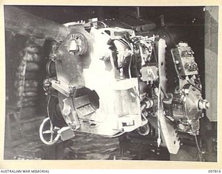 KAHILI, BOUGAINVILLE. 1945-10-05. THE BREECH OF A JAPANESE 6-INCH NAVAL GUN. THE FIRING MECHANISM HAS BEEN REMOVED BY DISPOSALS COMMISSION. THE GUN WAS MOUNTED AT THE ENTRANCE TO BOUGAINVILLE ..