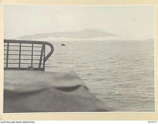 AT SEA, NEW GUINEA. 1944-06-02. AMERICAN LANDING BARGES CARRYING MEMBERS OF THE 37/52ND INFANTRY BATTALION IN MOVEMENT DURING THE DAWN ATTACK ON KARKAR ISLAND. THE MOTOR LAUNCH IN THE BACKGROUND IS ..