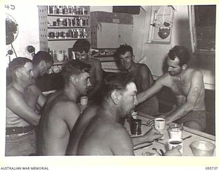 AT SEA OFF RABAUL, NEW BRITAIN. 1945-09-04. PETTY OFFICERS' MESS, HMAS VENDETTA. THE VENDETTA IS RETURNING TO JACQUINOT BAY AFTER PRE- SURRENDER DISCUSSIONS AT A SEA RENDEZVOUS OFF RABAUL BETWEEN ..