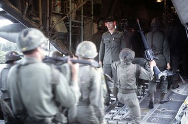 25th Infantry Battalion troops embark a 439th Tactical Airlift Wing C-130 Hercules aircraft ready to depart during Joint Airborne Airportability Tactical Training