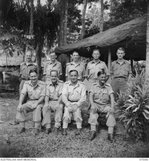 LAE, NEW GUINEA. 1944-08-28. OFFICERS OF "A" BRANCH HEADQUARTERS, NEW GUINEA FORCE, OUTSIDE THE UNIT OFFICE. LEFT TO RIGHT: FRONT ROW: VX24059 MAJOR (MAJ) A. M. RAWLINGS; QX6091 MAJ L. F. BOSWORTH; ..