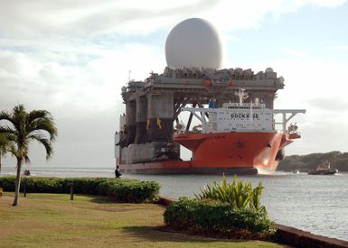 Starboard bow view showing the Civilian Contracted Marlin Class; Semi-submersible Heavy Lift Ship, Motor Vessel (MV) BLUE MARLIN, underway as it enters the harbor at Naval Base (NB) Pearl Harbor, Hawaii (HI), after completing a 15,000-mile journey while transporting the massive Sea Based X-Band Radar (SBX). The SBX is a combination of the worlds largest phased array X-band radar carried aboard a mobile, ocean-going semi-submersible oil platform